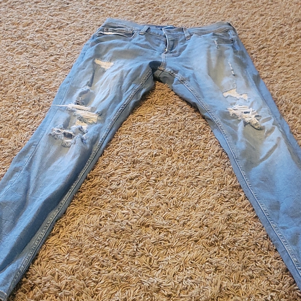 Young mens distressed skinny jeans